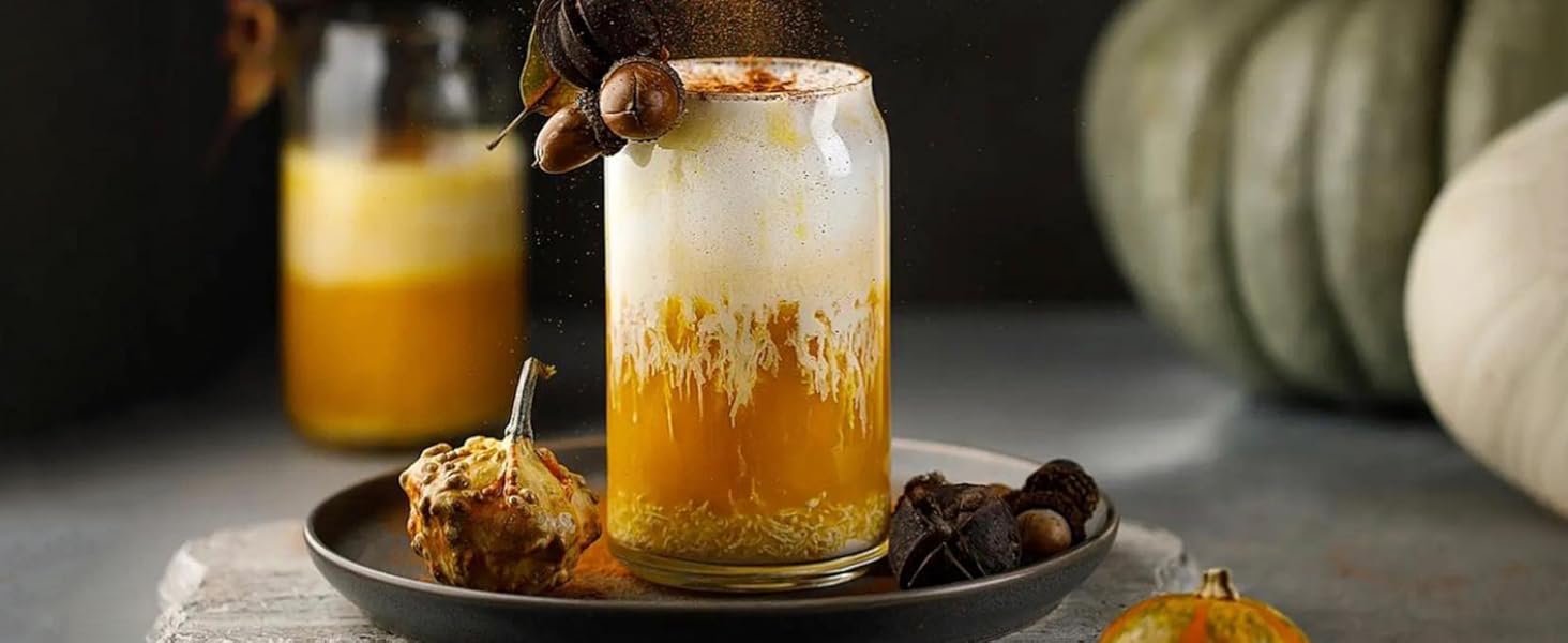 can glass filled with smoothie and fruits with it