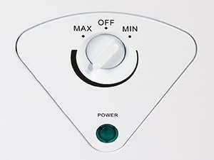 Closeup of adjustable thermostat control dial on the front of the Koolatron chest freezer