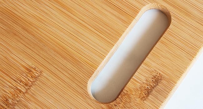 Close up detail of bamboo cutting board with handle