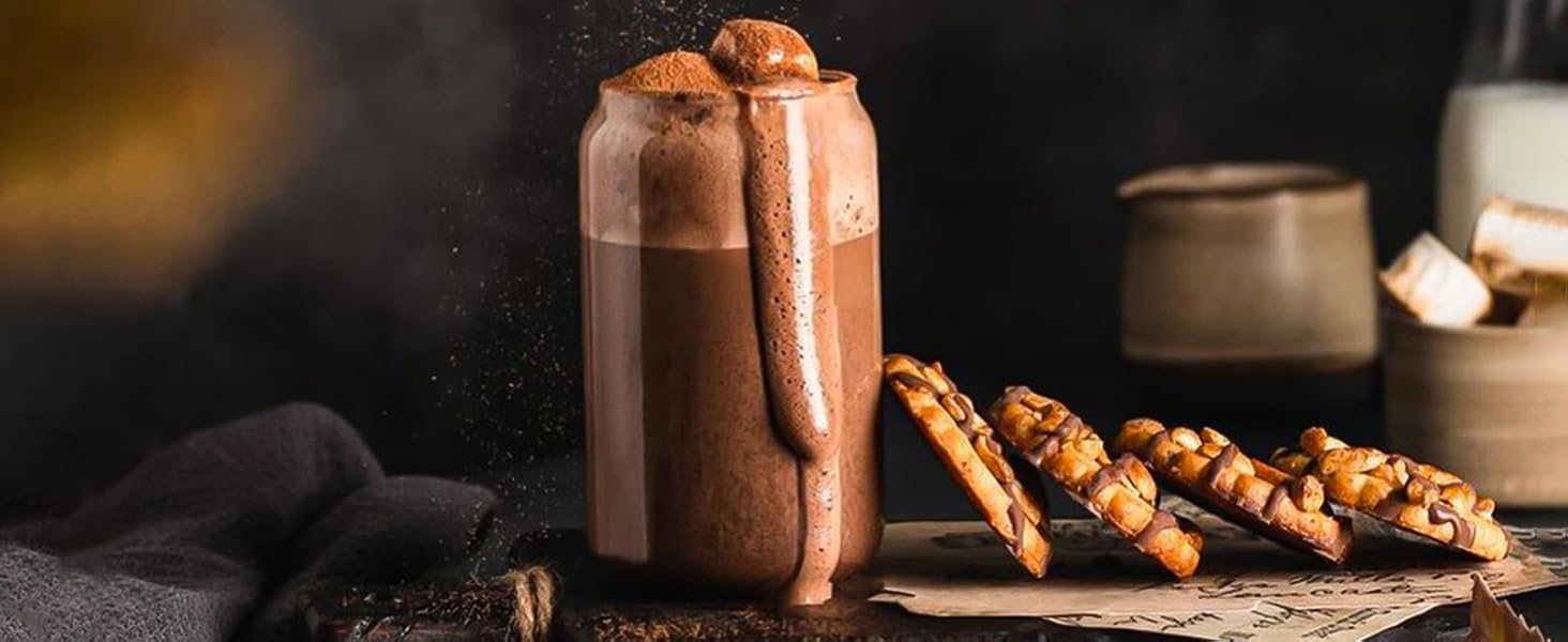 can glass on counter with cookies and iced coffee