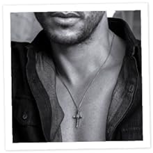 Black and white picture of man wearing sterling silver cross pendant necklace