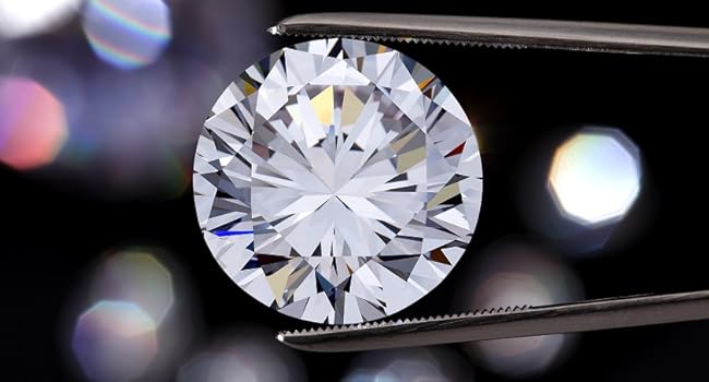 brilliant diamond held by tweezers