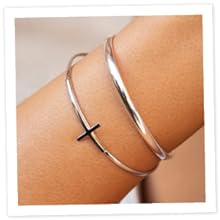 Sterling silver cross cuff and plain cuff on woman's wrist