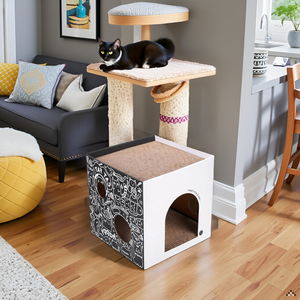 A cozy living room with a large window overlooking a lush garden, with the product placed near the w