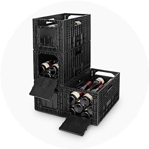 3 black weinboxes stacked on top of each other next to 1 open black weinbox.